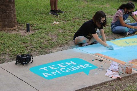 student doing chalk art