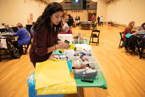 student working with art supplies