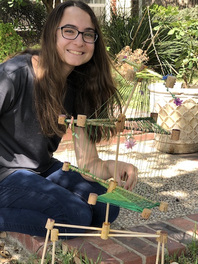 Spotlight Student at Home with Sculpture